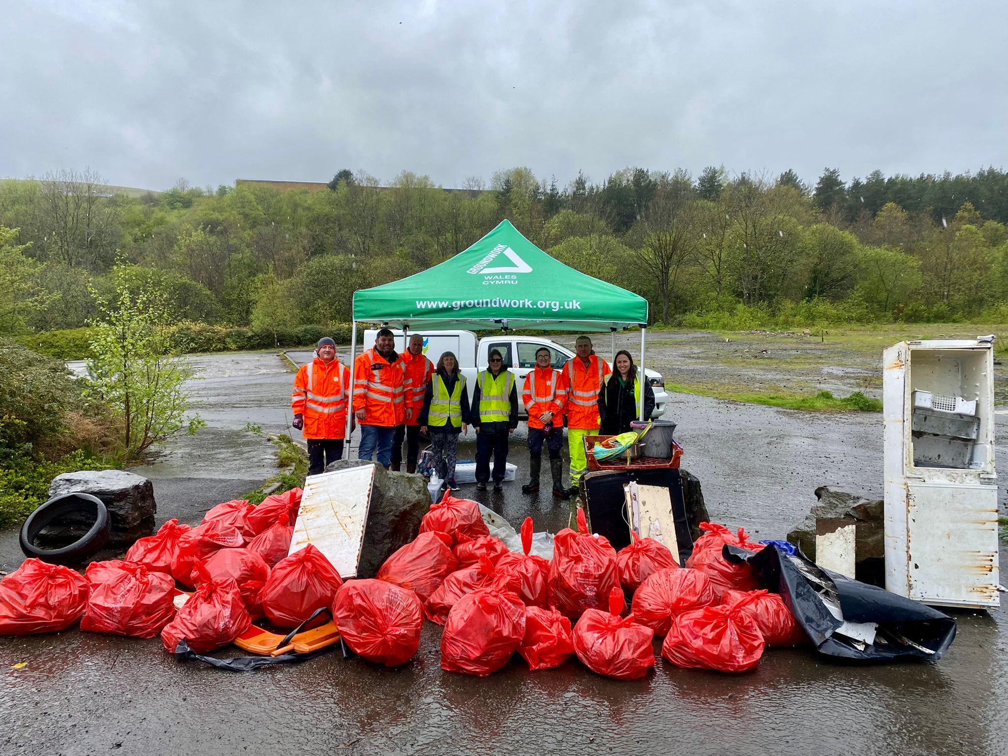 Volunteers at Ground Work Wales get litter picking at the River Rhymney in Wales